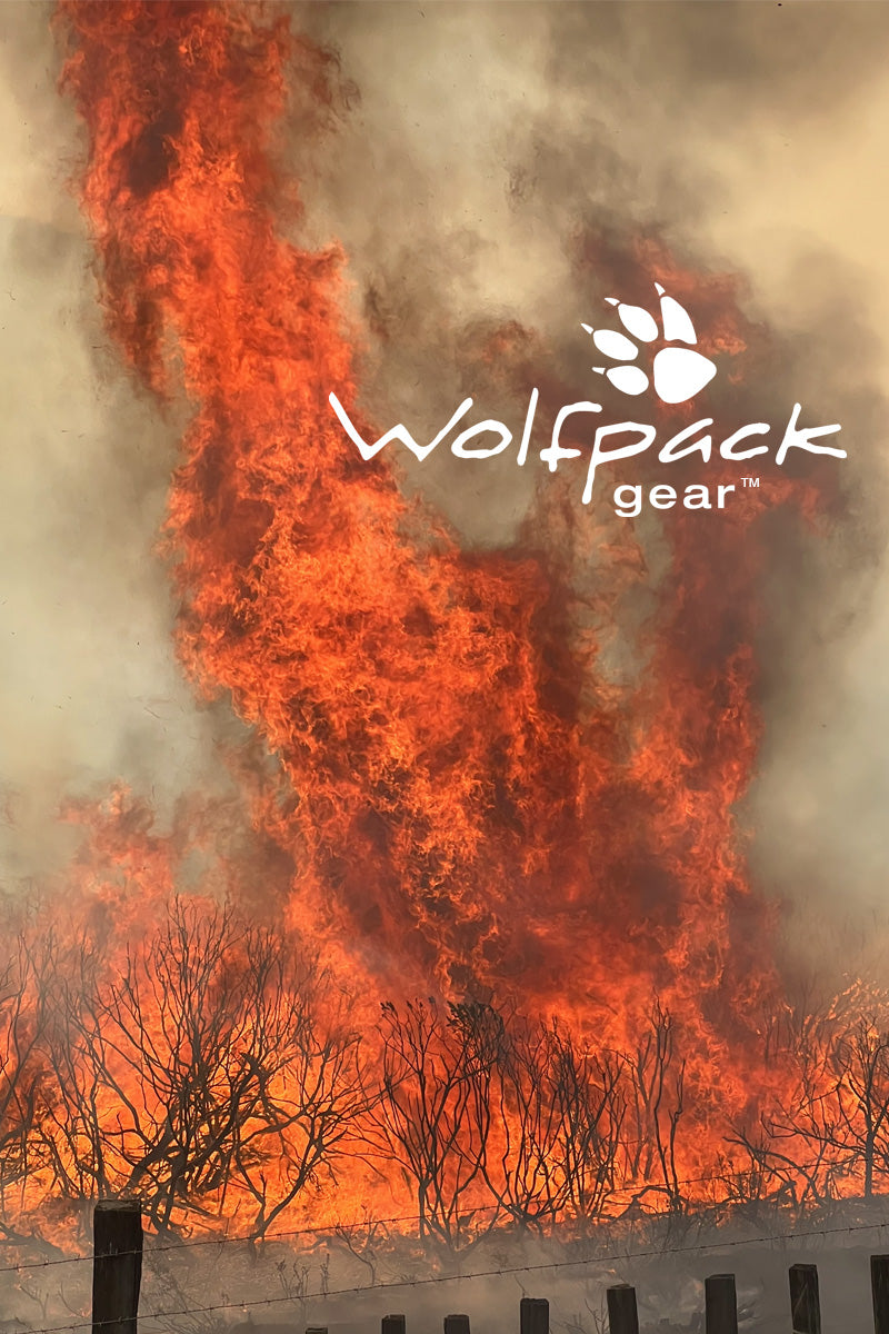 Wolfpack Gear™ logo over wildland brush fire