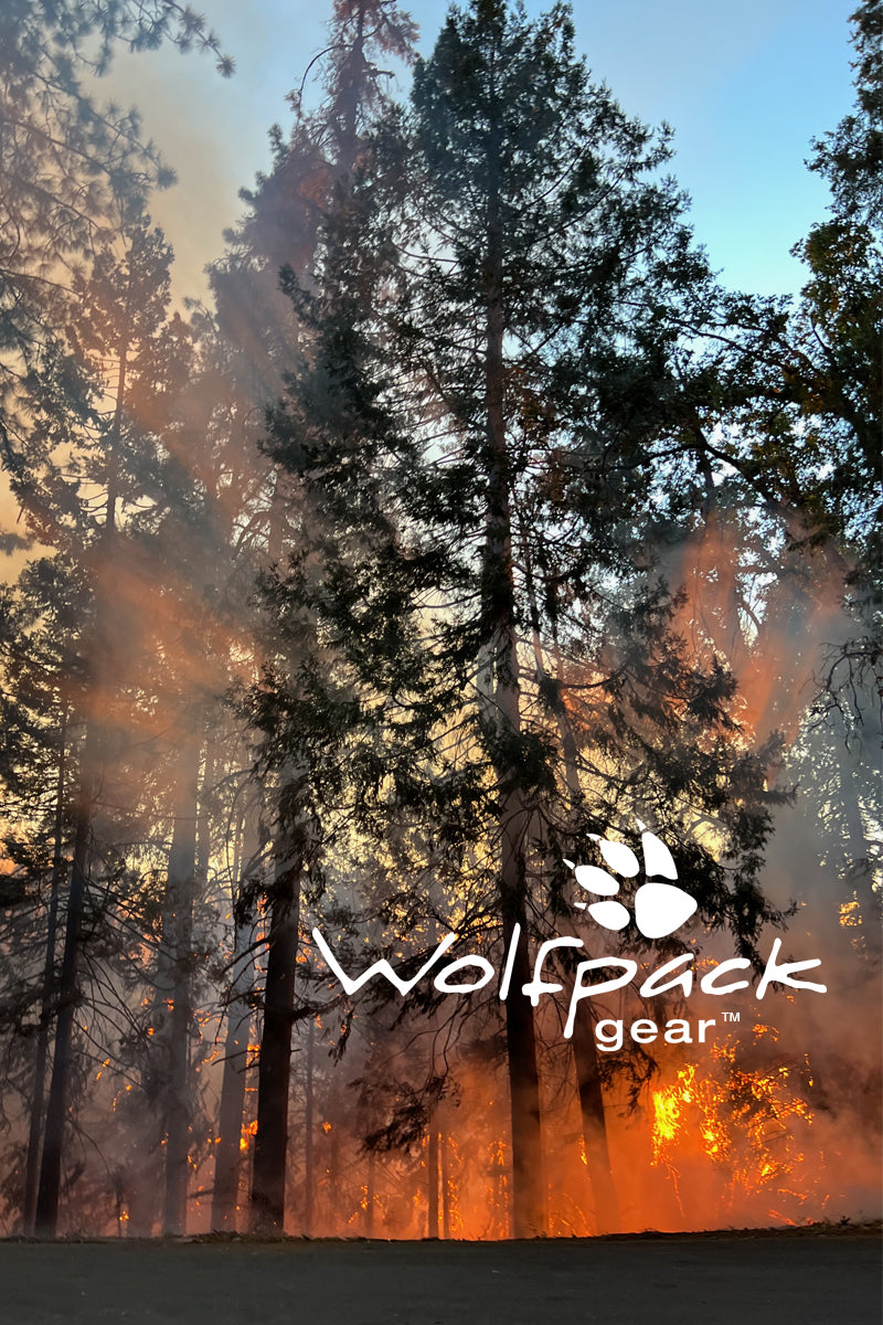 Wolfpack Gear™ logo over wildland forest fire